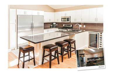 Example of a mid-sized minimalist u-shaped light wood floor eat-in kitchen design in Other with an undermount sink, flat-panel cabinets, white cabinets, granite countertops, beige backsplash, stone tile backsplash, stainless steel appliances and a peninsula