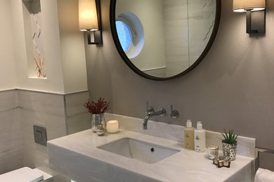 This is an example of a small contemporary 3/4 bathroom in Edinburgh with furniture-like cabinets, an open shower, porcelain tile, a wall-mount sink and an open shower.
