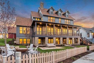 Example of a large farmhouse blue two-story concrete fiberboard exterior home design in Salt Lake City with a shingle roof