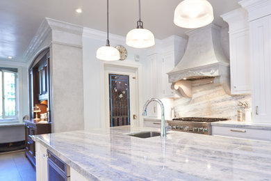 Example of a large classic l-shaped medium tone wood floor open concept kitchen design in Toronto with an undermount sink, shaker cabinets, white cabinets, quartz countertops, multicolored backsplash, stone slab backsplash, stainless steel appliances and an island