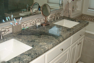 Example of a large classic master beige tile and mosaic tile drop-in bathtub design in Austin with recessed-panel cabinets, white cabinets, an undermount sink and quartz countertops