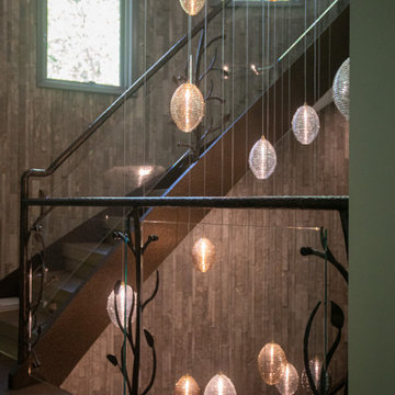 NATURE'S EMBRACE OF IRON AND GLASS RAILING