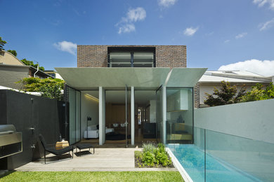 Photo of a mid-sized contemporary pool in Sydney.