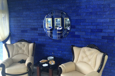 Example of a small minimalist loft-style living room design in Other with a bar and blue walls