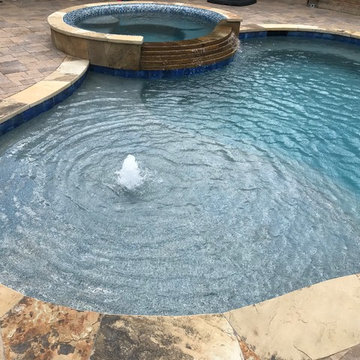 Cozy Lagoon pool with jump rocks and waterfall