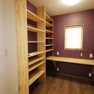 Design ideas for a large modern home office and library in Other with painted wood flooring and green floors.