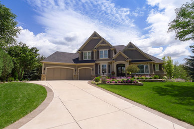 Example of a classic beige two-story concrete fiberboard gable roof design in Minneapolis