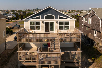 Example of a beach style deck design in Other