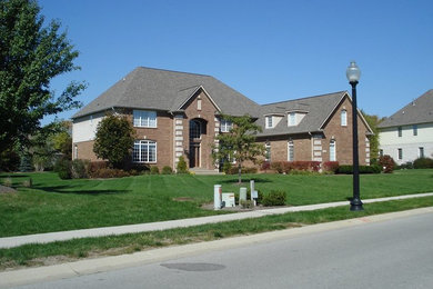 Inspiration for a timeless two-story brick exterior home remodel in Indianapolis