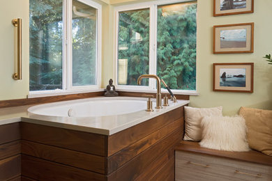 Example of a large zen master green tile and mosaic tile porcelain tile and gray floor bathroom design in Other with flat-panel cabinets, gray cabinets, green walls, an undermount sink, quartz countertops and white countertops