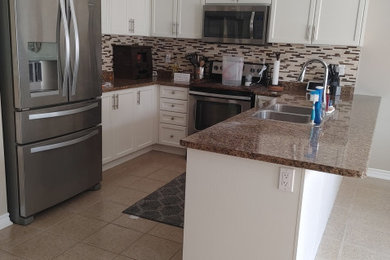Example of a mountain style kitchen design in Toronto