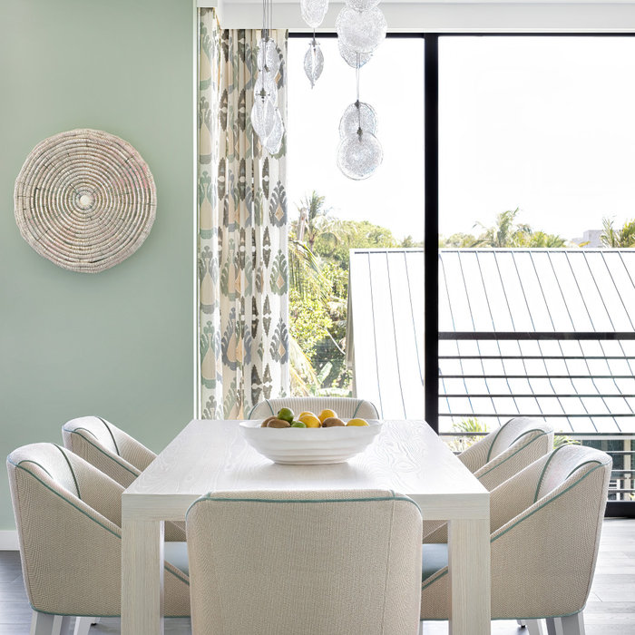 Example of a beach style dining room design in Miami