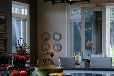 Example of a large classic l-shaped dark wood floor open concept kitchen design in Other with an undermount sink, recessed-panel cabinets, gray cabinets, granite countertops, black backsplash, stone slab backsplash, paneled appliances and an island