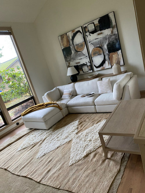 Layering a rug over carpet in living room