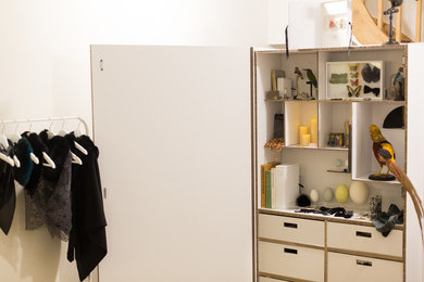 Inspiration for a contemporary storage and wardrobe in Angers with white cabinets.
