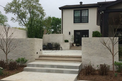 Example of a large classic white two-story stucco exterior home design in Nashville with a shingle roof