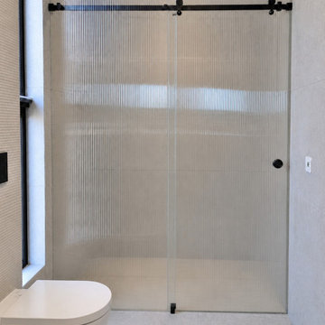 Sliding fluted glass shower screen in Yarraville