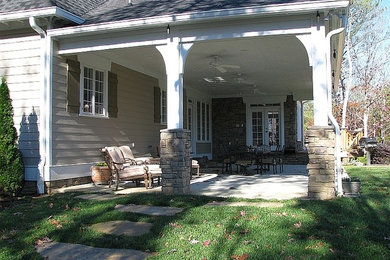Beige two-story mixed siding exterior home idea in Other