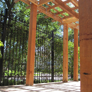 High function in a small side yard! Pergola, raised bed, mirrored wall, fountain