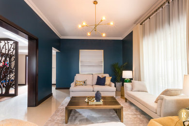Example of a minimalist living room design in Other with blue walls