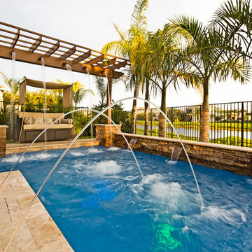 Roman/Geometric Pool With Pergola, Laminar Deck Jets and Spa in Boynton Beach