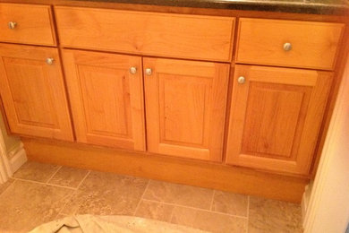 Bathroom - small traditional bathroom idea in Other with raised-panel cabinets