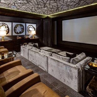 Design ideas for an expansive traditional enclosed home cinema in Orange County with carpet, a projector screen, brown walls and multi-coloured floors.