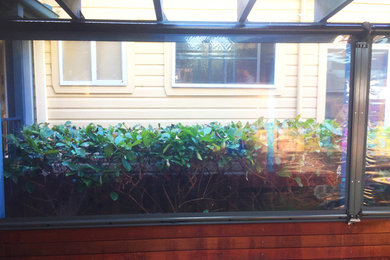 Photo of a mid-sized transitional exterior in Sydney.