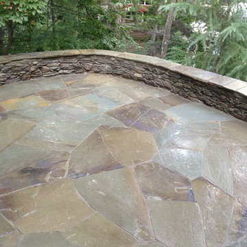 Irregular flagstone patio and dry stack retaining wall