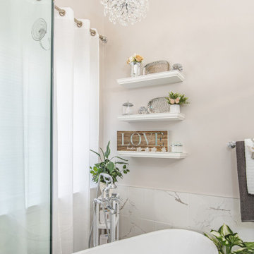 Bathroom remodel in Gainesville, VA with white bathroom countertop & corner bath