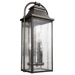 Visual Comfort Studio Collection - Feiss 3-Light Outdoor Lantern, Bronze - The Feiss Wellsworth three light outdoor wall fixture in antique bronze creates a warm and inviting welcome presentation for your home's exterior. A subtle interplay of traditional design elements and nautical influences creates the charming visual approach to the Wellsworth outdoor collection by Feiss. Two very different aesthetics are available. A new Antique Bronze finish paired with Clear Seeded glass creates a more traditional look to these outdoor light fixtures; while a new Painted Brushed Steel finish coupled with Clear glass reflects a more contemporary approach. The Wellsworth collection includes a 3-light outdoor pendant, a 3-light outdoor post lantern, and 3-light small and medium outdoor lanterns, as well as a 4-light large outdoor lantern. Cast aluminum construction ensures durability. Wet Rated.