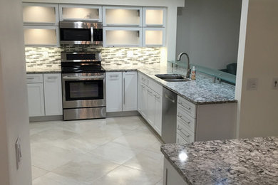 Example of a mid-sized trendy kitchen design in Tampa