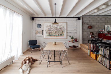 Example of a mid-sized urban light wood floor and beige floor dining room design in Montreal with white walls