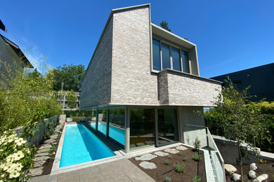 Example of a mid-sized minimalist exterior home design in Vancouver