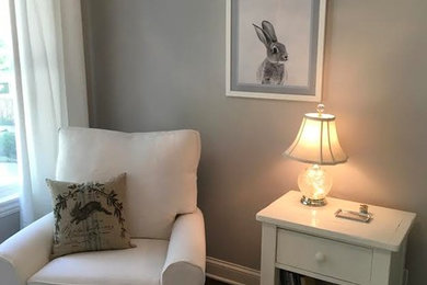 Nursery - large traditional gender-neutral dark wood floor and brown floor nursery idea in Milwaukee with gray walls