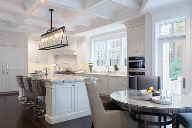 Huge minimalist kitchen pantry photo in Boston with an undermount sink, shaker cabinets, white cabinets, quartzite countertops, metallic backsplash, stone tile backsplash, paneled appliances and two islands