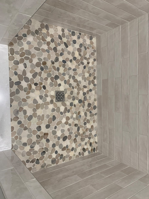 New shower floorAre the small holes in the grout ok? Future problems?