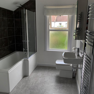 The Bathroom- a cost effective bathroom, with neutral details to appeal to rente