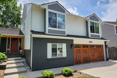 Mid-sized arts and crafts blue two-story concrete and shingle exterior home photo in Denver with a shingle roof and a brown roof