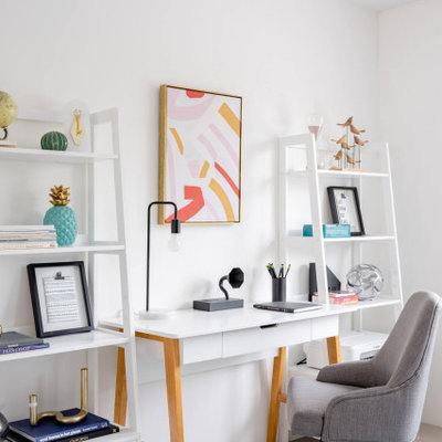 Example of a mid-century modern home office design in Orange County
