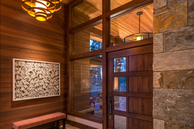 Example of a transitional ceramic tile entryway design in Sacramento