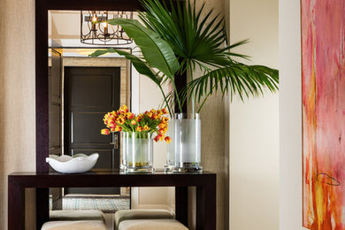Entryway - mid-sized tropical porcelain tile and white floor entryway idea in Miami with beige walls and a gray front door