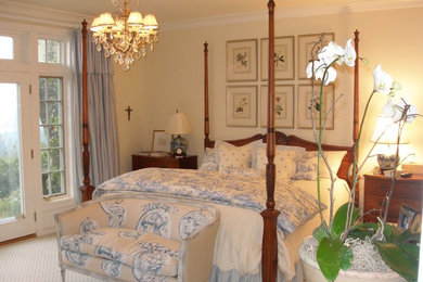 Example of a classic carpeted bedroom design in Portland with beige walls