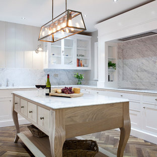 Large transitional kitchen pantry ideas - Large transitional u-shaped dark wood floor kitchen pantry photo in Dublin with a single-bowl sink, beaded inset cabinets, white cabinets, quartz countertops, white backsplash, stone slab backsplash, stainless steel appliances and an island