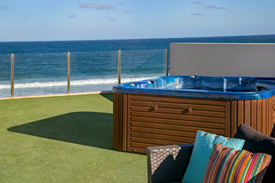 Design ideas for a mid-sized contemporary rooftop aboveground pool in Sydney with a hot tub.