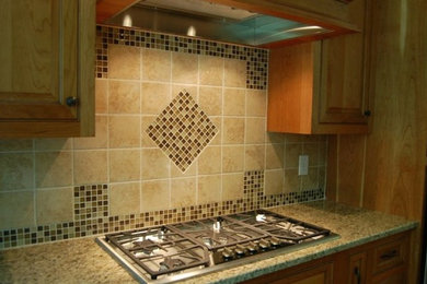 Kitchen photo in Richmond with medium tone wood cabinets, granite countertops and stainless steel appliances