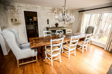 This is an example of an eclectic kitchen/dining combo in Baltimore with medium hardwood floors.