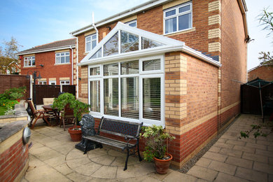 White Conservatory with PVCu Bi-Fold Doors