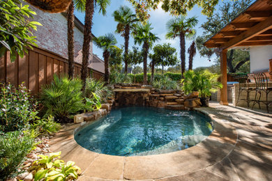 Example of an island style backyard privacy pool design in Dallas