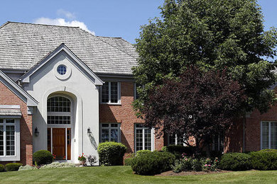 Mid-sized elegant two-story mixed siding exterior home photo in DC Metro